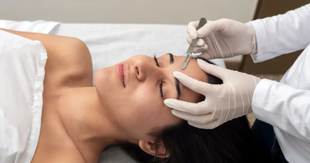 woman receiving a dermaplaning facial treatment in Coralville, IA